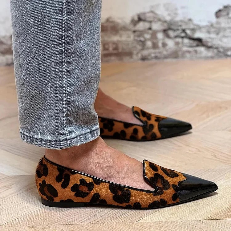 Brown animal print flats with a sleek silhouette and soft supportive construction, shown from a front angle