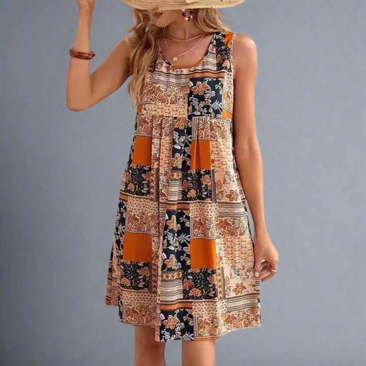 Side view of the Indie boho patchwork mini dress showing empire waist and flowy above-the-knee skirt