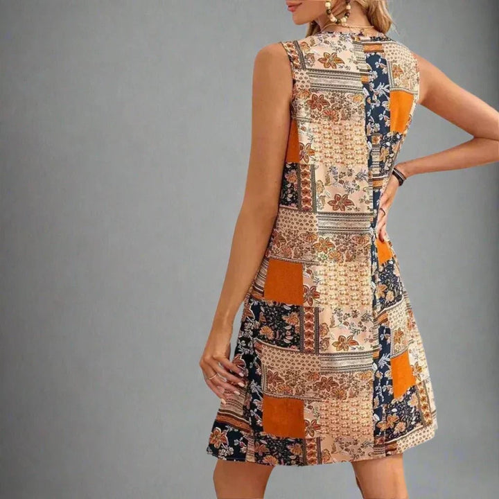 Close-up of the patchwork floral and geometric print detail on the Indie mini dress