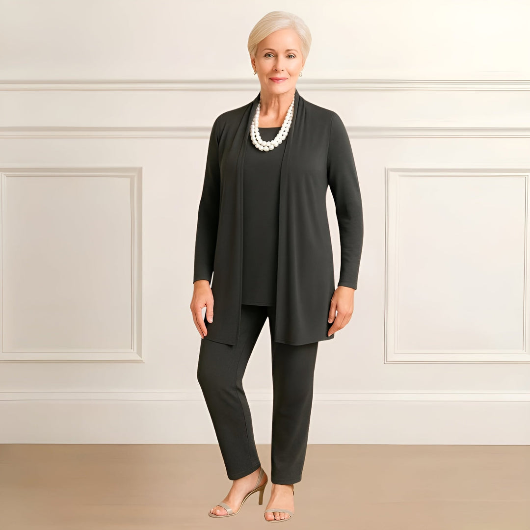 Model wearing the Ingrid set in burgundy, demonstrating the flattering midsection coverage of the draped cardigan
