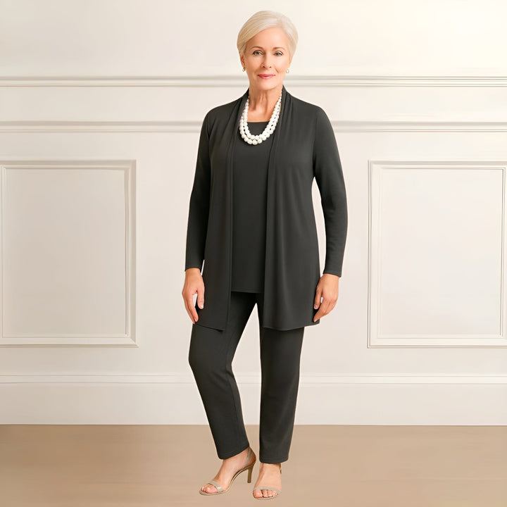 Model wearing the Ingrid set in burgundy, demonstrating the flattering midsection coverage of the draped cardigan