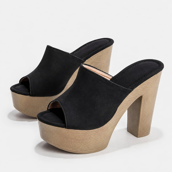Close-up of Ingrid sandal strap and buckle detail in black