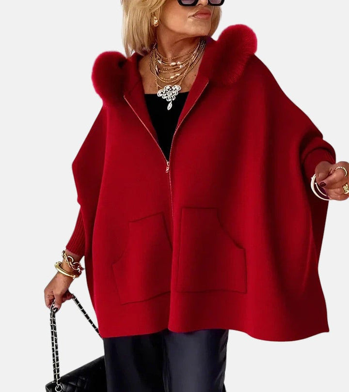 Irene hooded coat in a neutral color, worn outdoors in a lifestyle setting