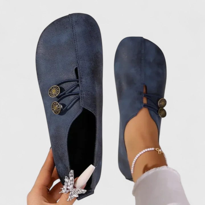 Irene elegant loafers in navy blue displayed at an angle highlighting the flattering elongated toe shape