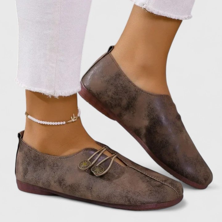 Overhead flat-lay of all four color options of Irene elegant loafers: black, light brown, navy blue, and dark brown