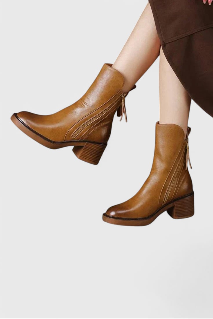 Irina sleek ankle boots in brown shown at an angle highlighting the smooth contour design