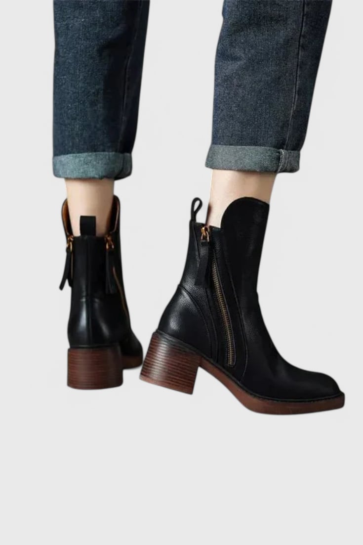 Pair of Irina sleek ankle boots in black displayed side by side on a clean background