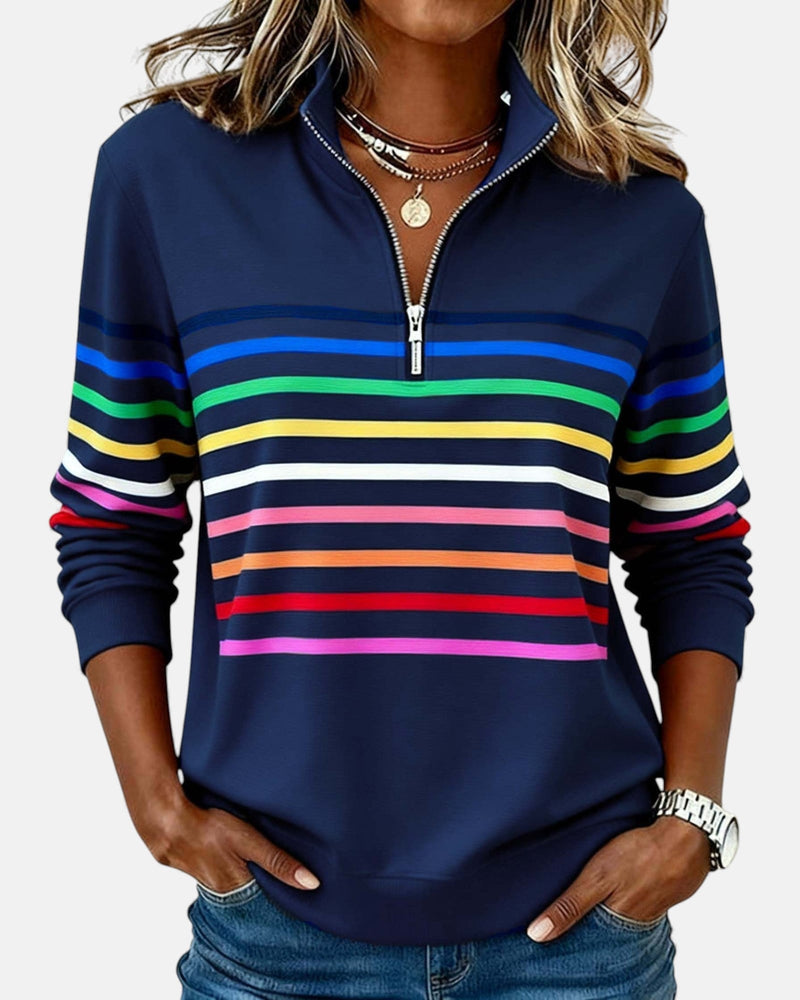 Front view of rainbow striped zip sweatshirt showing colorful vertical stripe pattern and relaxed silhouette