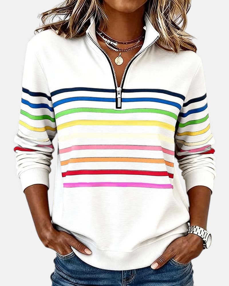 Close-up of rainbow stripe detail and front zipper on a casual zip sweatshirt