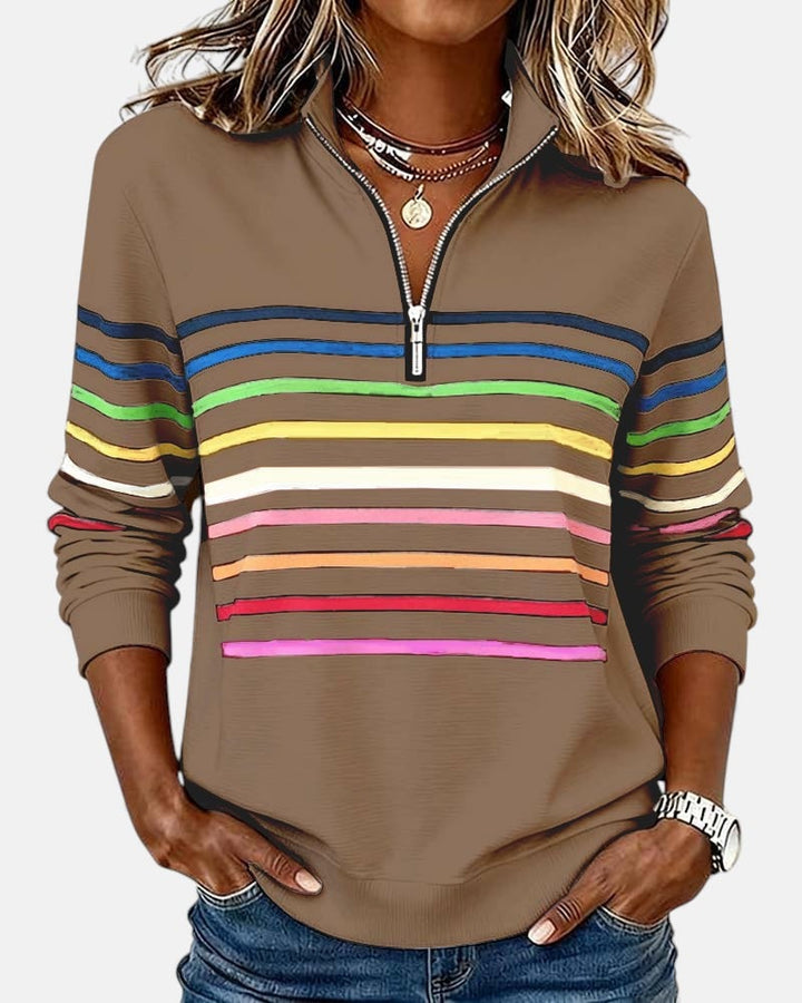 Side view of relaxed-fit rainbow striped zip sweatshirt showing length and smooth silhouette