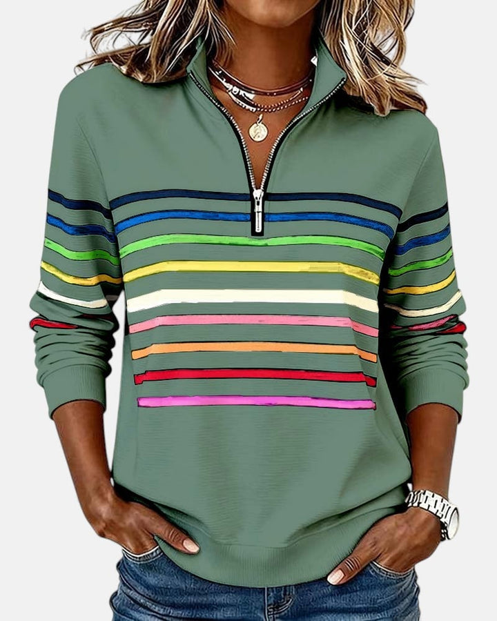 White rainbow striped zip sweatshirt laid flat showing full front design