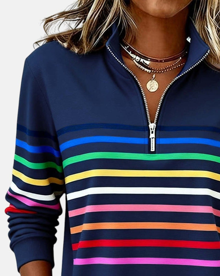Green rainbow striped zip sweatshirt front view on a standing model