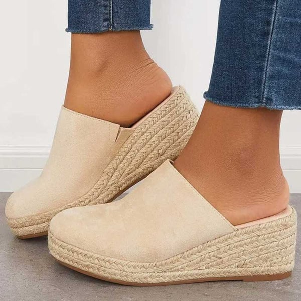 Side view of Iris women's sandals in beige highlighting the minimal silhouette and supportive strap design