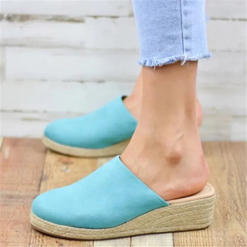 Iris women's sandals in sky blue displayed at an angle to show the refined profile and comfortable footbed