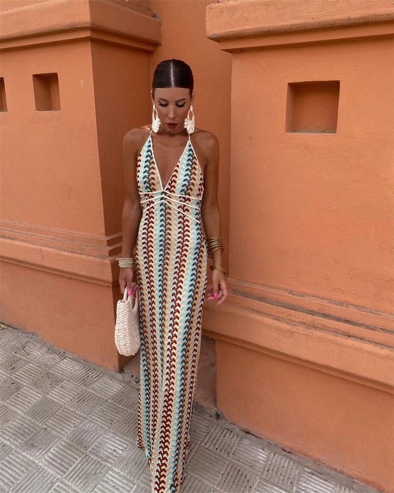 Front view of the Iris beige-multi crochet draped dress on a model at the beach