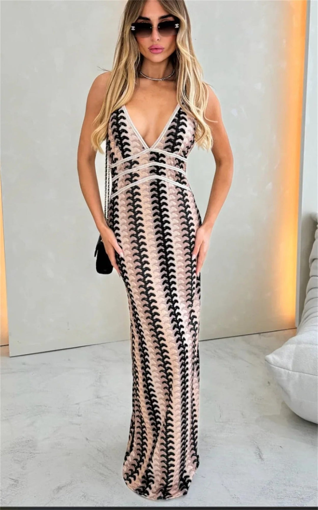 Full-length shot of the Iris crochet beach dress in natural sunlight