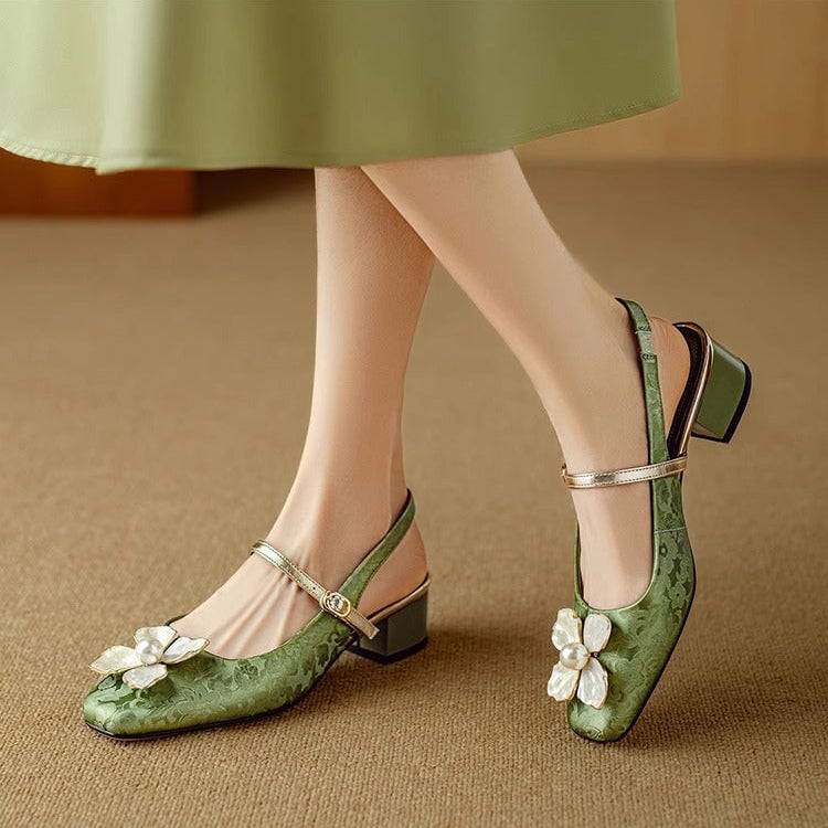 Isabeau floral mary jane pumps in green worn on feet, styled with a midi skirt