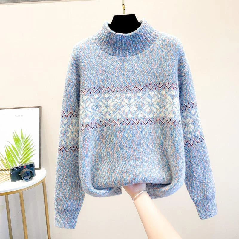 Women's snowflake knit sweater with high neckline in pink, shown from the front