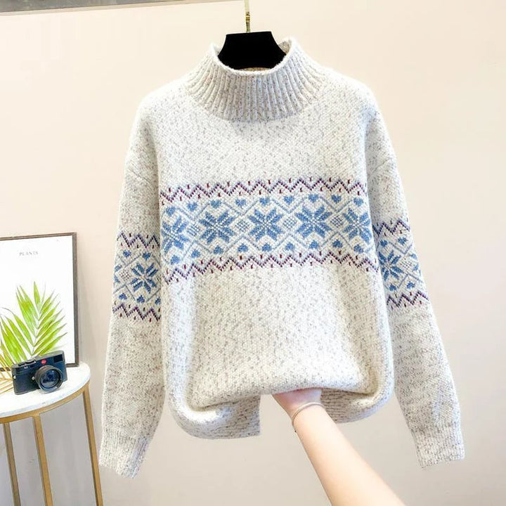 Snowflake knit sweater in blue displayed on a model from a side angle