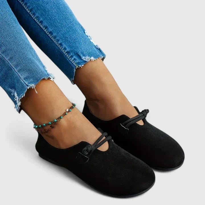 Pair of Isabella orthopedic loafers in black and beige shown side by side
