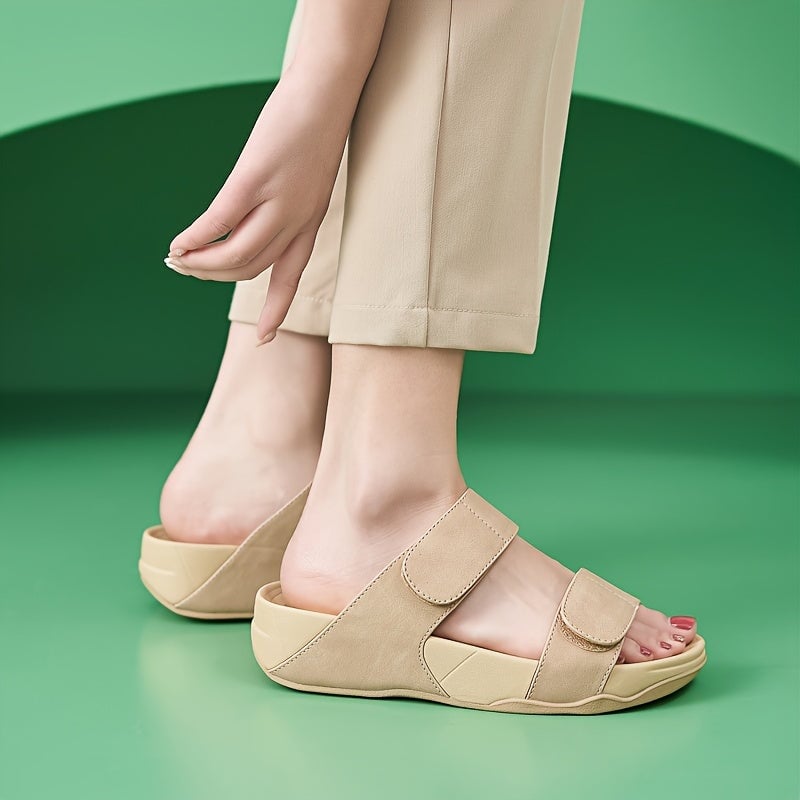 Isabella beige sandals styled with a flowing white sundress on a sunny day