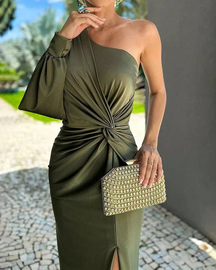 Front view of the Isabella green pleated dress showing the flattering sculpted silhouette and subtle shimmer detail