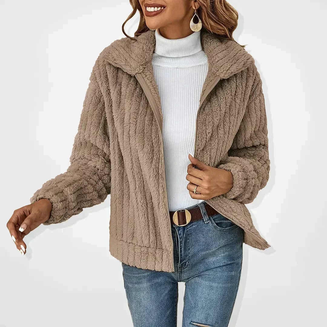 Woman wearing the Isadora fluffy cardigan in khaki with a wide plush collar and relaxed fit