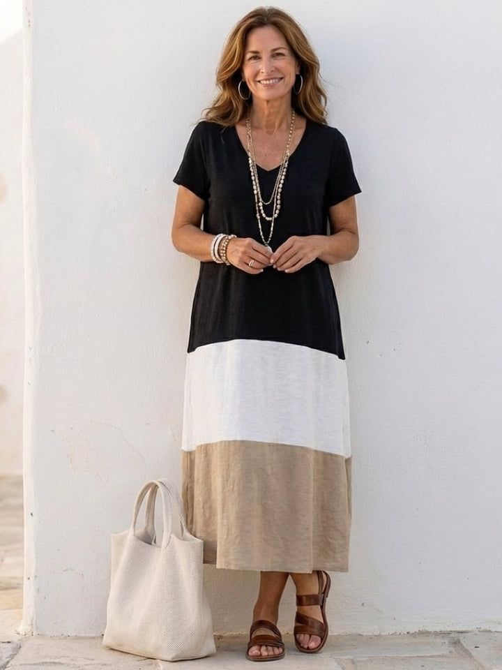 Woman wearing the Isadora three-tone color block V-neck midi dress in a relaxed fit, front view