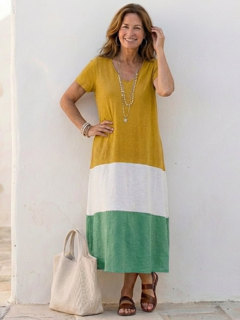 Model styling the Isadora color block midi dress with casual accessories