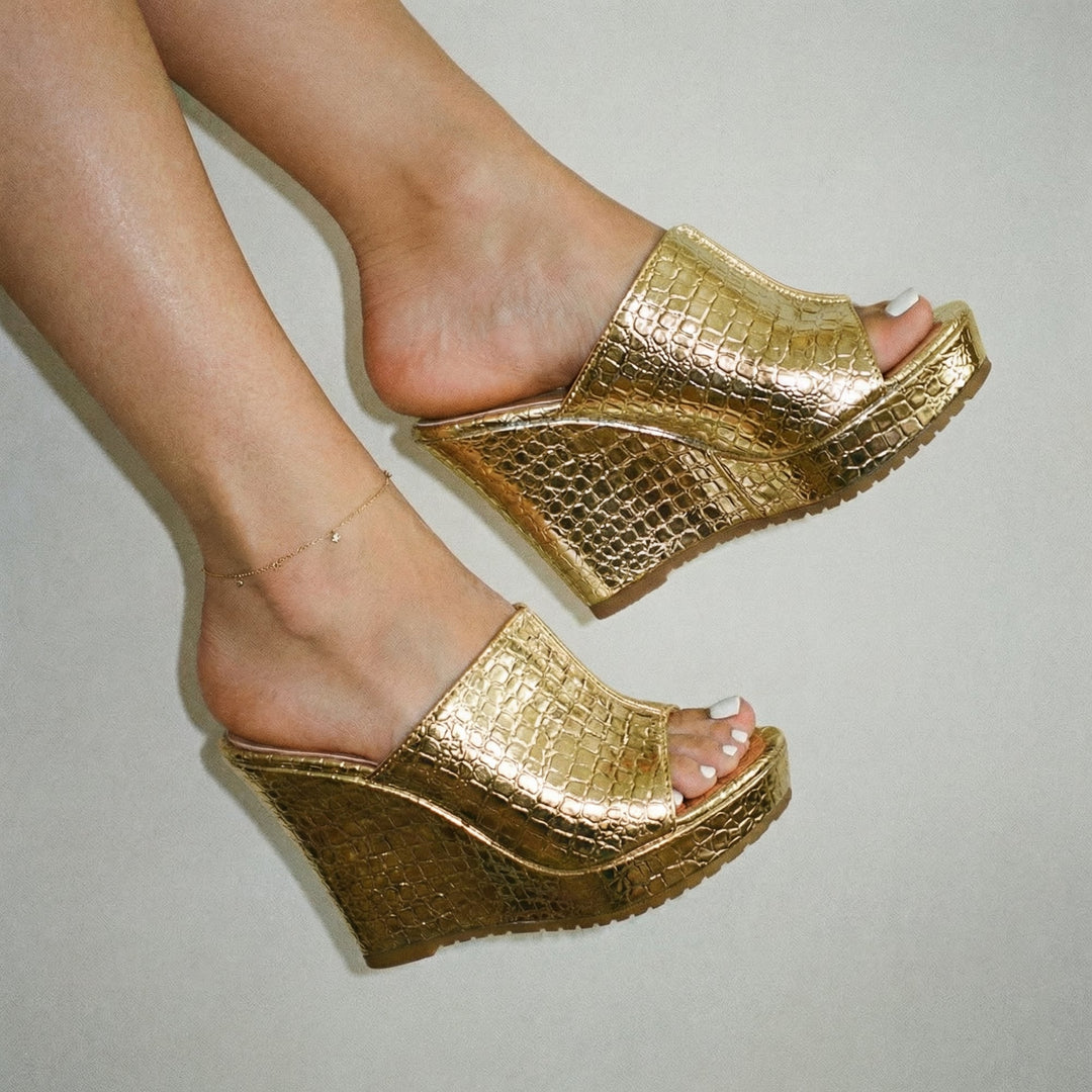 Top-down view of Isadora gold open-toe wedge sandals showing the footbed