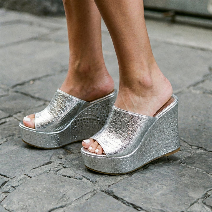 Isadora silver platform wedge sandals shown from the front on a white background