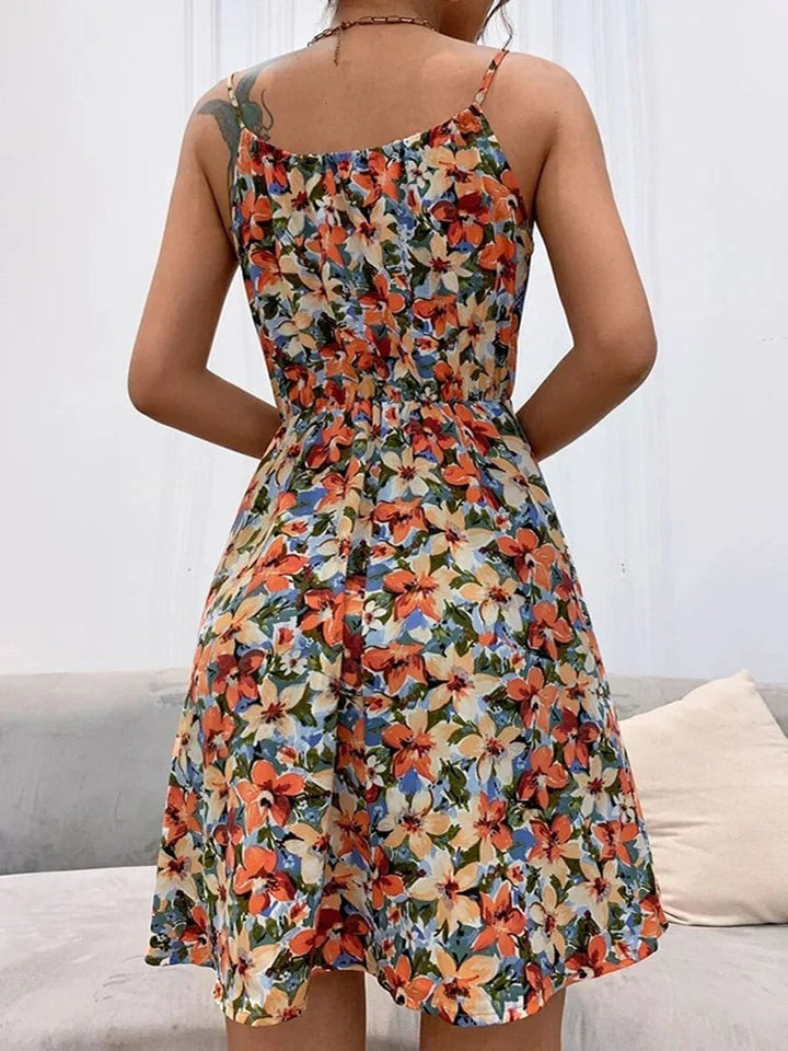 Close-up of lace-up halter neckline detail on a floral summer dress in pink