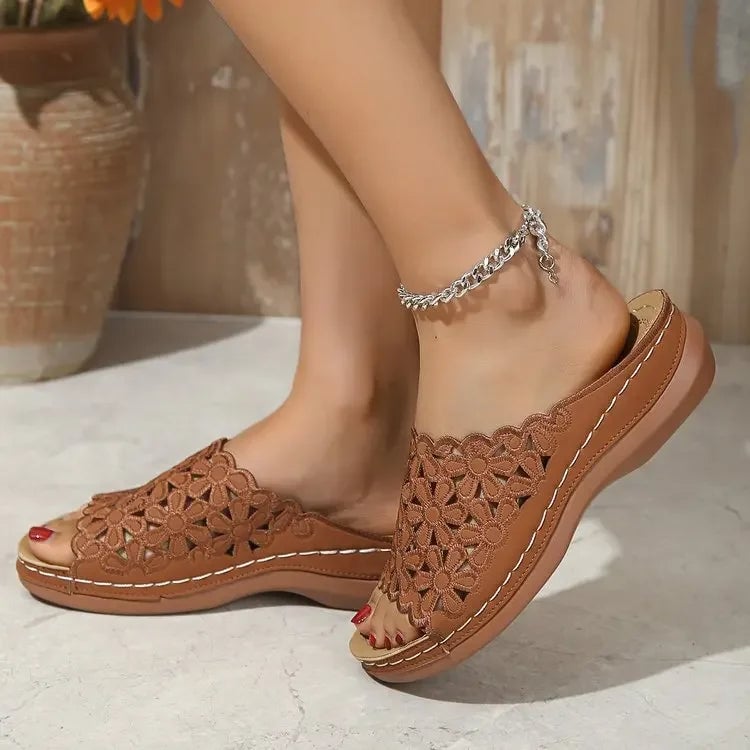 Side view of Isla women's sandals in brown showing delicate floral detailing