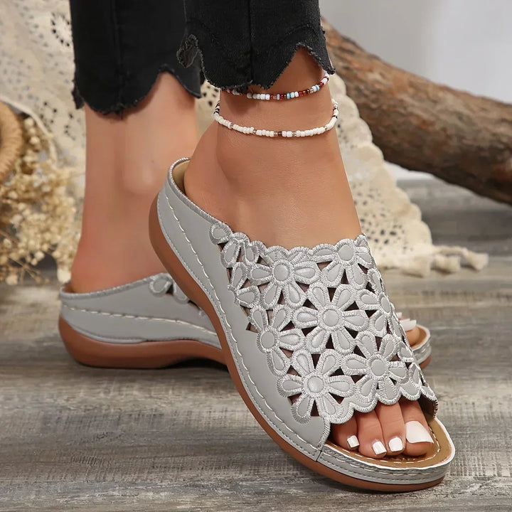 Isla women's sandals in gray styled with a flowy summer dress