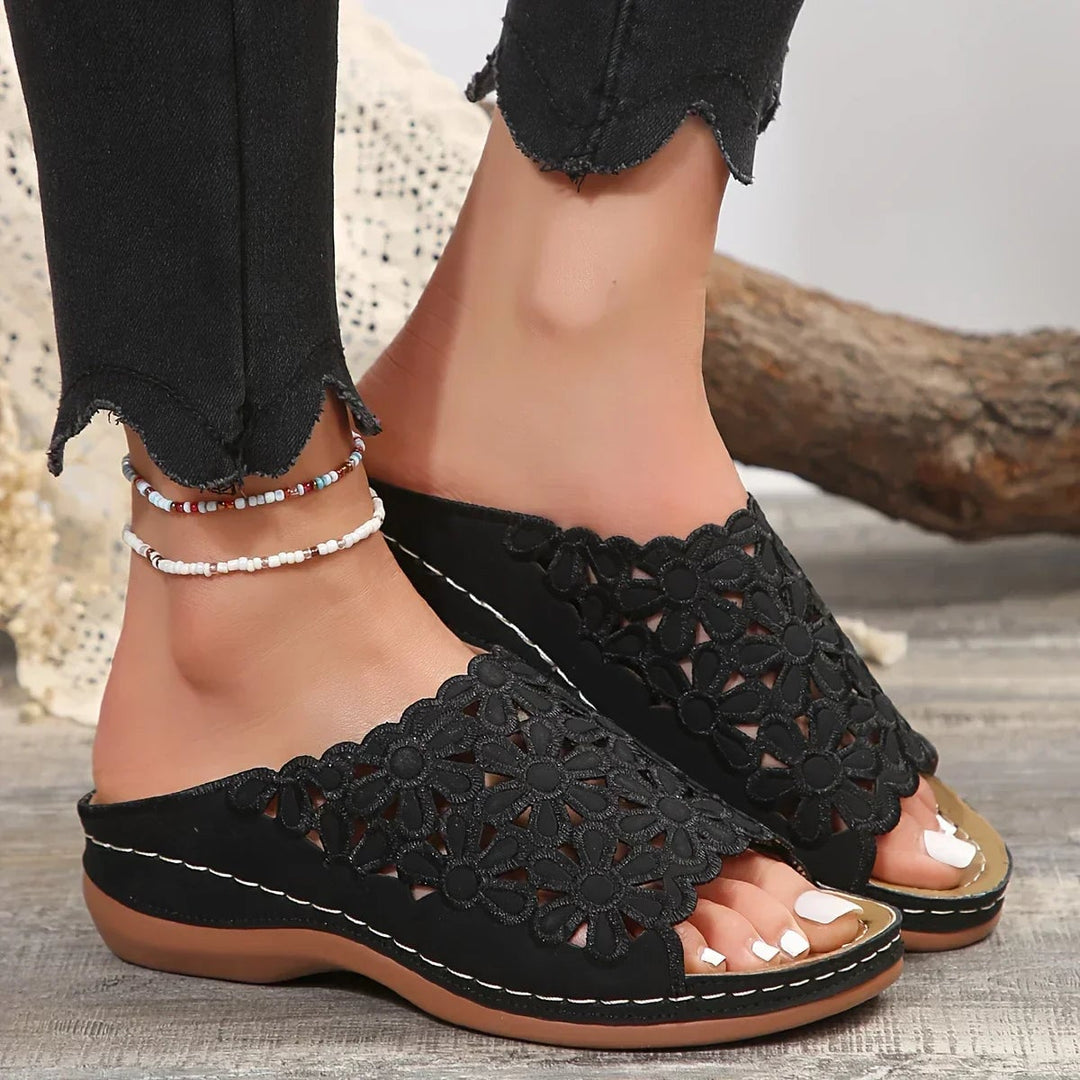 Close-up of the floral accent and padded footbed on the Isla sandal