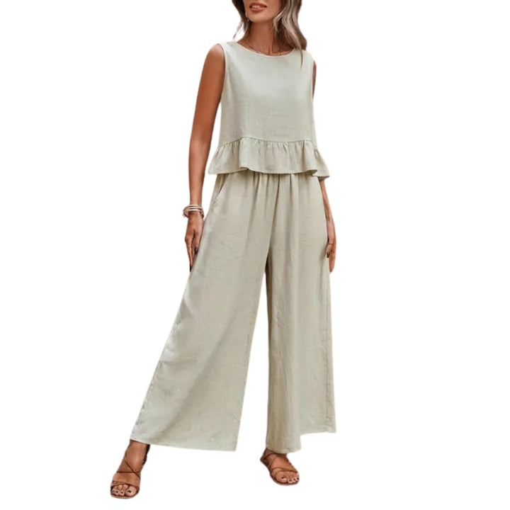 Woman wearing the Isla ruffle-hem tank top and wide-leg pants two-piece set in beige, styled with strappy sandals