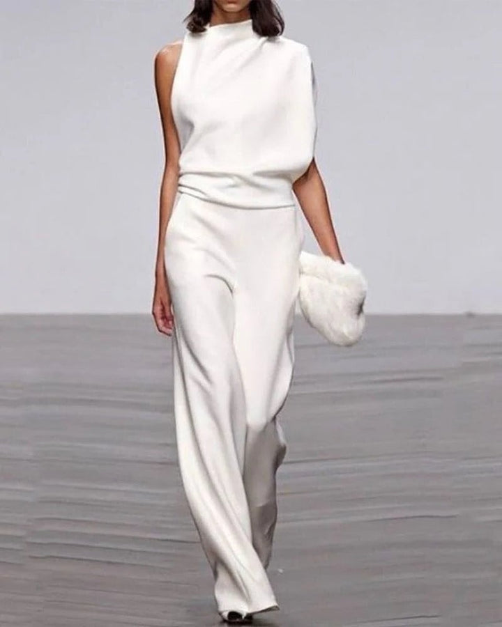 Ivory sleeveless wide-leg jumpsuit with mock neck and asymmetric draped shoulder, front view