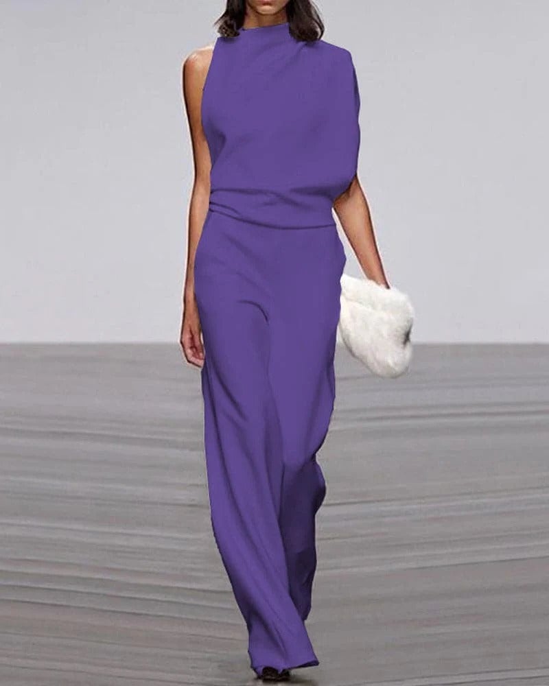Side view of ivory wide-leg jumpsuit highlighting elongated wide-leg silhouette