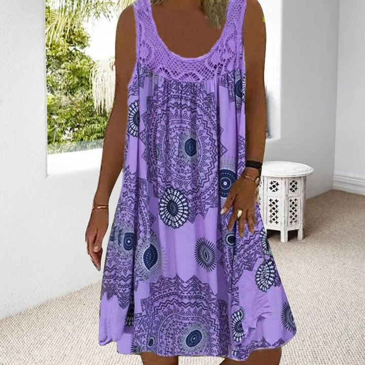 Model wearing the sleeveless summer dress in purple, full-length view