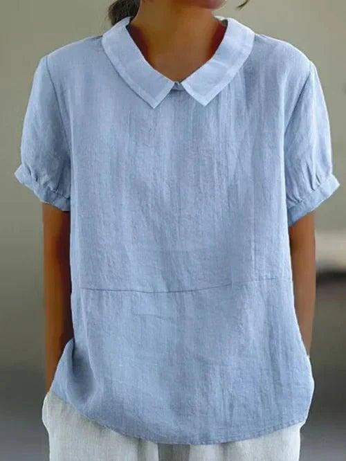 Front view of the Ivy Peter Pan collar short sleeve top in blue with contrast white rounded collar and cuffed sleeves