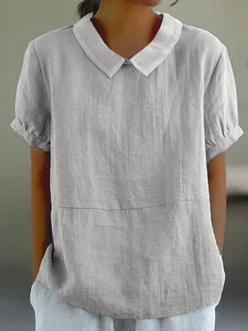 Side view of the Ivy linen-look casual top in blue showing relaxed fit and horizontal front seam detail