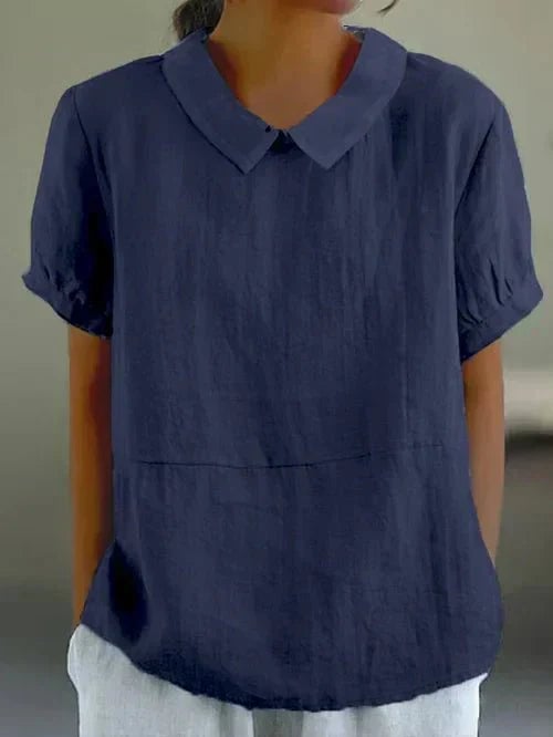 Ivy Peter Pan collar top styled with white trousers for a polished daytime look
