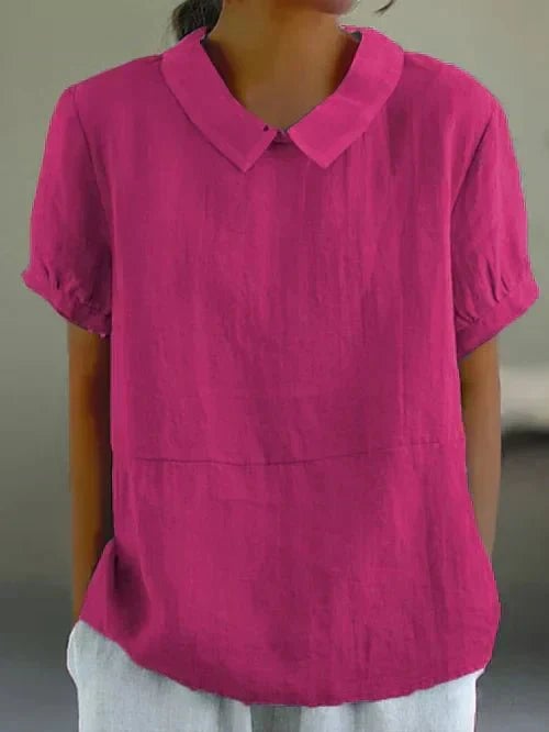 Flat lay of the Ivy top showing all available color options including pink, white, gray, and marine blue
