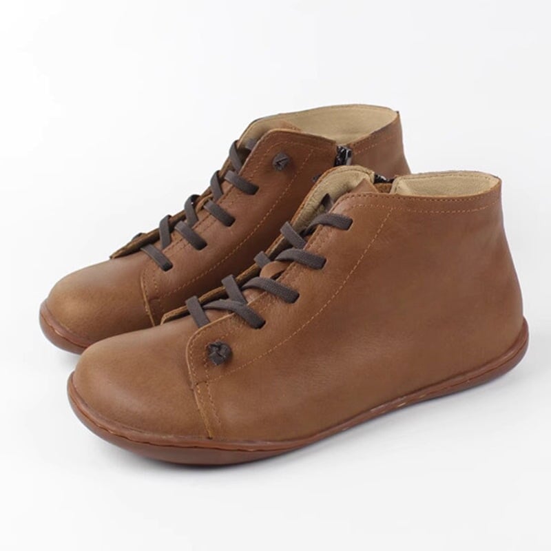Side view of Ivy zip boots in black showing the easy side zip closure
