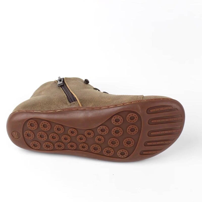 Overhead flat-lay of all three Ivy zip boot color options: gray, brown, and black