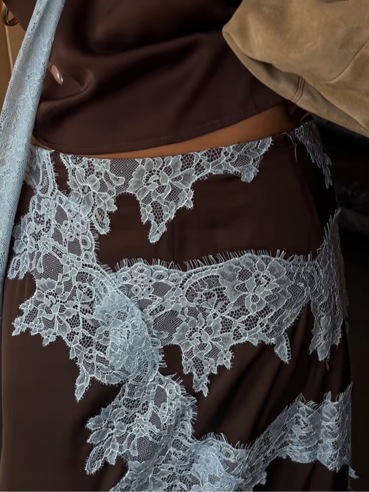 Close-up of the lace panel top paired with the coordinated blue and brown skirt