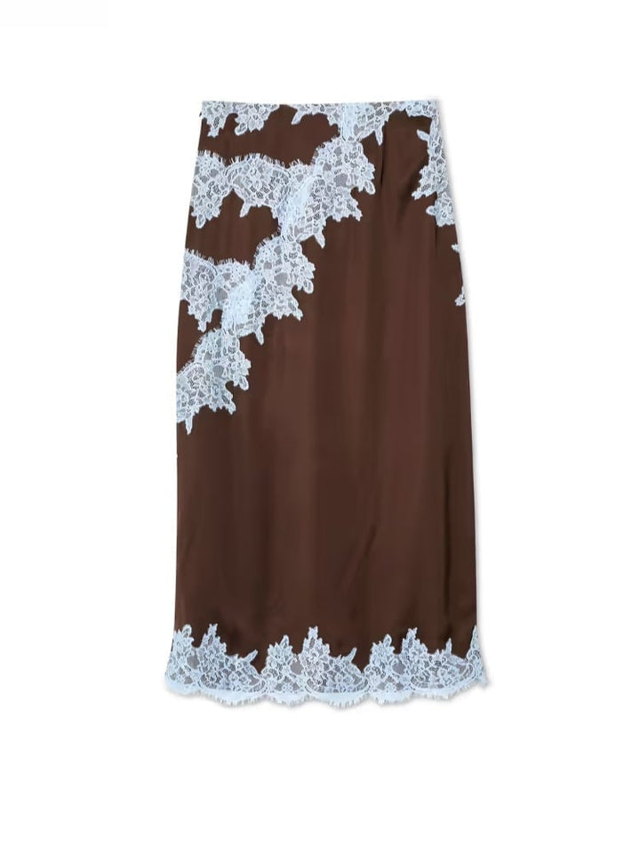 Overhead flat lay of the brown and blue lace panel top and skirt set