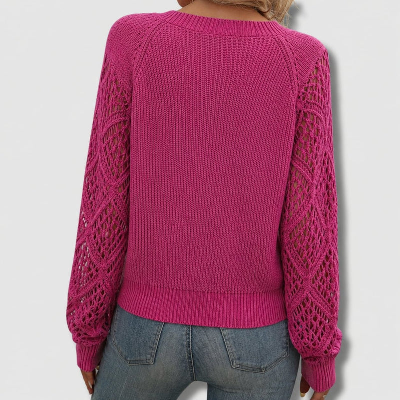 Front view of the elegant V-neck sweater in pink highlighting the graceful drape and feminine neckline