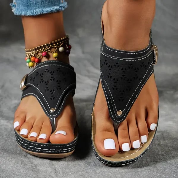 Jade orthopedic sandal in bordeaux red showing cushioned sole and minimalist strap design, side view