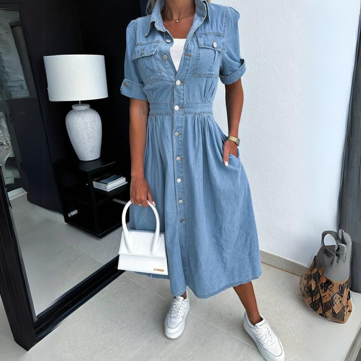 Close-up of the full button-front closure and snap-close chest pocket flaps on the Jade denim midi dress